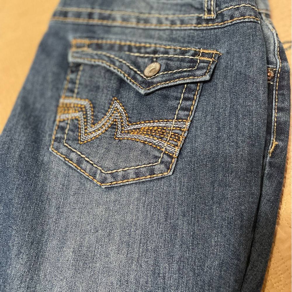 Nice Blue jeans; 14 P the back pocket is eye catching! Cato’s gentle worn.